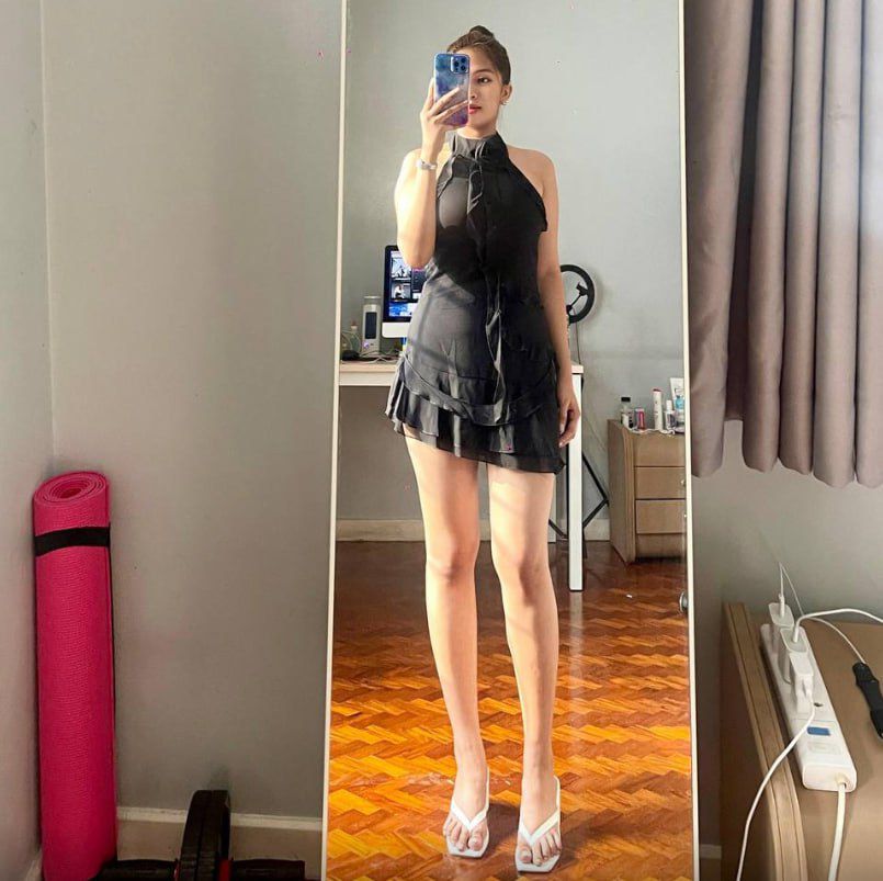 A smiling woman with a warm, reassuring expression